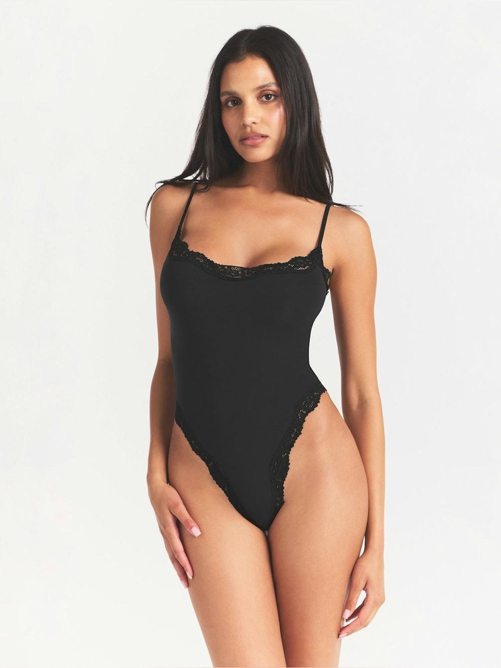 SKIMS Fits Everybody Lace Cami Bodysuit in the color Onyx